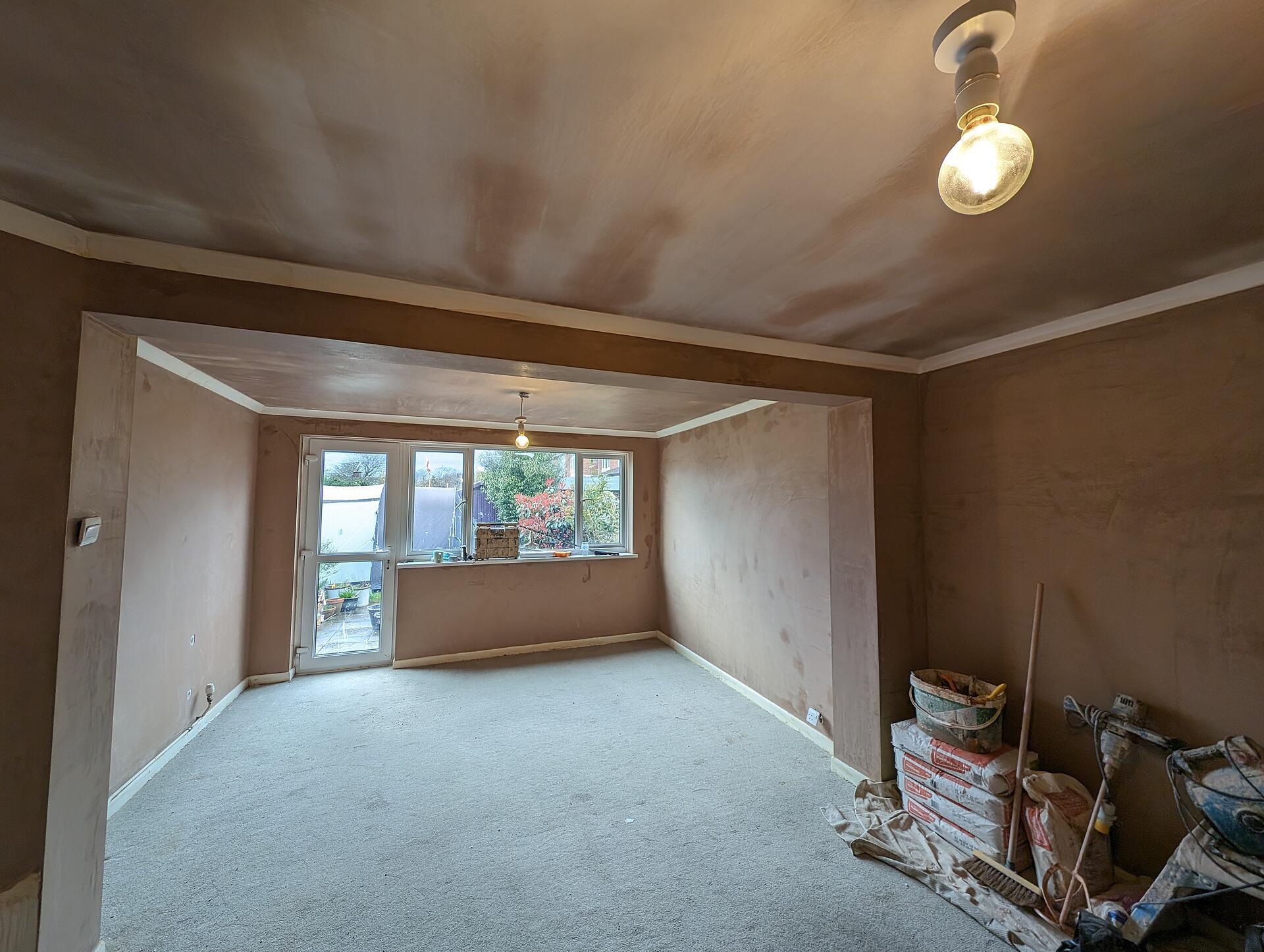 Through lounge fully re-plastered, walls and ceilings carrying an even finish around the coving and garden window